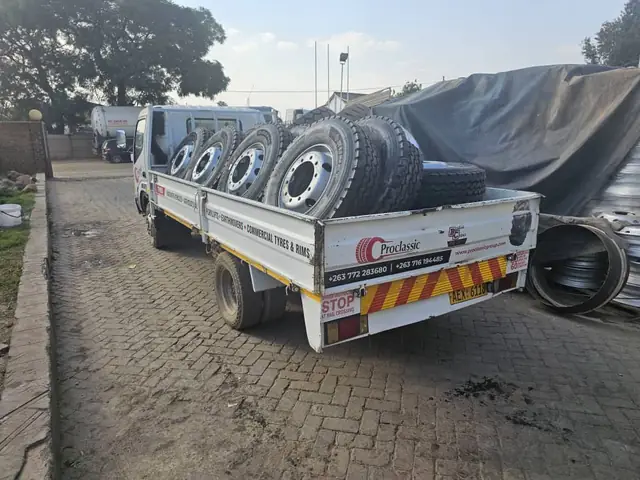Truck tyres and rims loaded for delivery